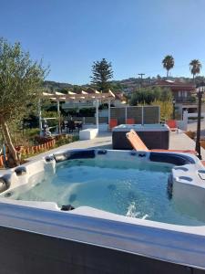 a hot tub on the roof of a house at tzogias apartments helen in Argostoli