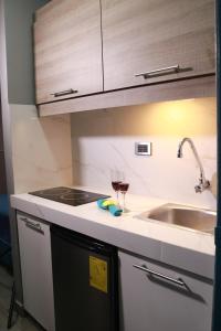 Kuchyň nebo kuchyňský kout v ubytování SUITES FullHouse
