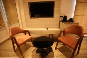 TV a/nebo společenská místnost v ubytování Grace Inn Hotel Dehradun