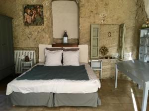 En eller flere senge i et værelse på Le Mas de pierre-étoile