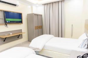 Postelja oz. postelje v sobi nastanitve DUQUM PLAZA HOTEL