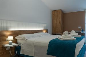 Postel nebo postele na pokoji v ubytování B&B Alba