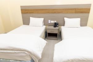 Postelja oz. postelje v sobi nastanitve DUQUM PLAZA HOTEL