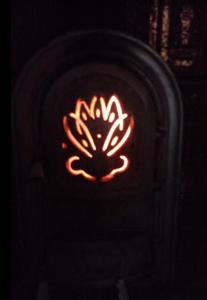 a neon sign is lit up in the dark at La gura sobei in Mărăcineni