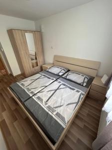 a bedroom with a large bed in a room at Apartmán Studničky v centre Žiliny in Žilina
