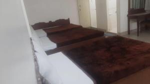 Katil atau katil-katil dalam bilik di MYSORE MAHALAKSHMI ROOMS