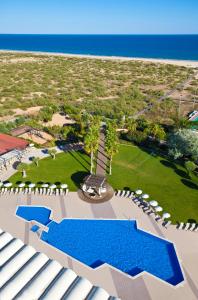 an aerial view of a resort with a pool and the ocean at Eurotel Altura in Altura