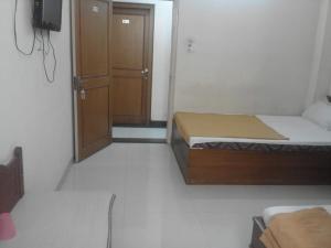 Katil atau katil-katil dalam bilik di MYSORE MAHALAKSHMI ROOMS