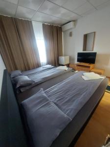 Postel nebo postele na pokoji v ubytování Magnific Hotel