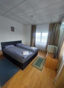Postel nebo postele na pokoji v ubytování Magnific Hotel