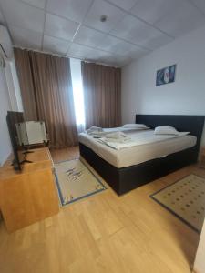Postel nebo postele na pokoji v ubytování Magnific Hotel