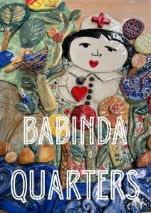 una pintura de una mujer con cuentas y otros minerales en Babinda Quarters, en Babinda
