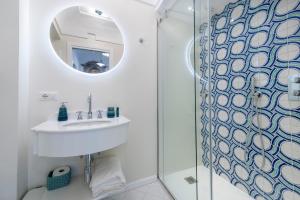 a bathroom with a sink and a mirror at Casa Don Ciccio Positano in Positano +12 photos