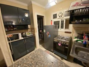 A kitchen or kitchenette at Comfortable studio in madinaty compound B11