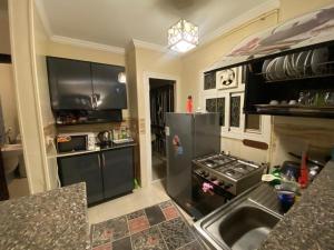 A kitchen or kitchenette at Comfortable studio in madinaty compound B11