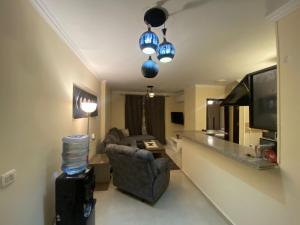 A television and/or entertainment centre at Comfortable studio in madinaty compound B11
