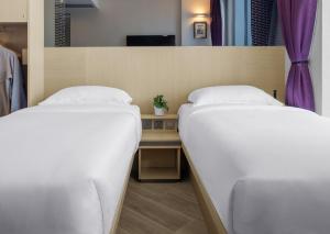 Krevet ili kreveti u jedinici u okviru objekta Starphire Hotel
