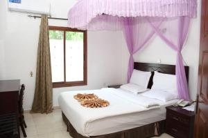 Ένα ή περισσότερα κρεβάτια σε δωμάτιο στο Aron International Hotel