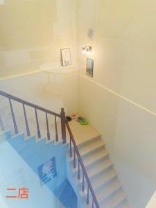 a view of a staircase in a house at Unique Homestay in Tainan