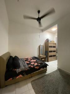 מיטה או מיטות בחדר ב-Razumi's Homestay