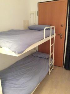 Katil dua tingkat atau katil-katil dua tingkat dalam bilik di Casas Da Duna