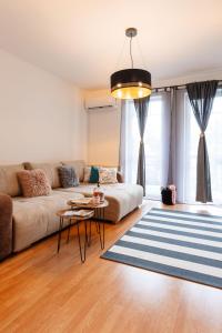 a living room with a couch and a table at BB21 Apartman Eger - City centre in Eger