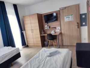 Postel nebo postele na pokoji v ubytování Sunny Hotel Straubing