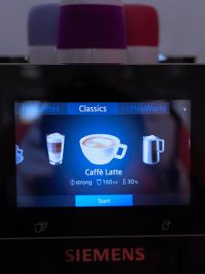 a screen of a camera with a cup of coffee at La Guirtelle in Lainsecq