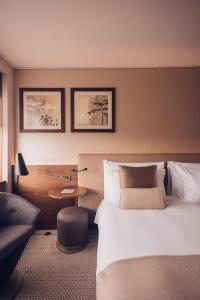 Cama ou camas em um quarto em Crowne Plaza Geneva by IHG