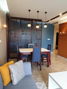 a dining room with a table and chairs at HOUSE EMAH in Douala