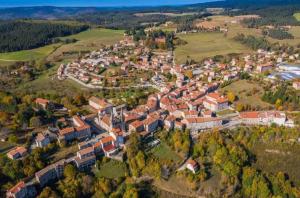 an aerial view of a town in the hills at Ecouter le silence à LALOUVESC in Lalouvesc