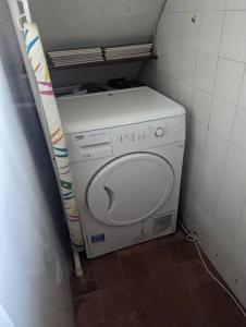 a washer and dryer in a small room at Great for Short Breaks and Ideal for Contractors. in Rochdale