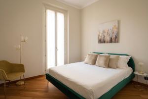 a bedroom with a large bed and a window at santa tecla living faravelli 4 in Milan