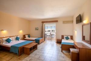 Voodi või voodid majutusasutuse Hotel Rossis toas