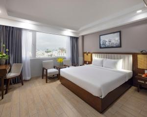 מיטה או מיטות בחדר ב-Sen Viet Hotel