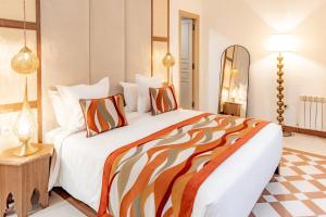 Postel nebo postele na pokoji v ubytování Riad Nyla Wellness and Spa