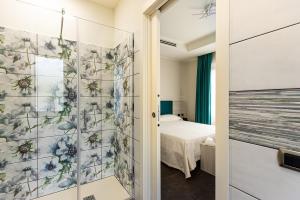 Postel nebo postele na pokoji v ubytování LUAL Bleisure Hotel