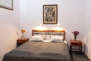 Posteľ alebo postele v izbe v ubytovaní Sewa Apartments