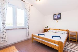 Posteľ alebo postele v izbe v ubytovaní Apartments Krizmanić