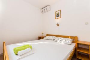Posteľ alebo postele v izbe v ubytovaní Apartments Krizmanić