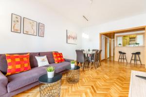 a living room with a couch and a table at Confort Barcelona Rentals in Barcelona