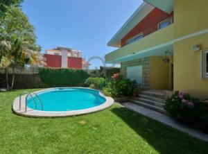 a swimming pool in the yard of a house at Cascais Center Dream House in Cascais