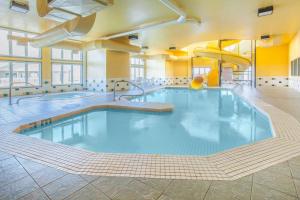 a large swimming pool in a hotel room at Super 8 by Wyndham Truro NS in Truro