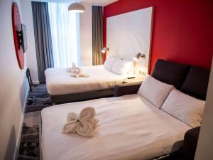 Postel nebo postele na pokoji v ubytování ibis Styles Glasgow Central