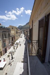 a view of a street from a balcony of a building at Dimore Barraco - SiciliaDaMare in Castellammare del Golfo