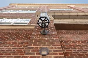 a street light on the side of a brick building at The Slate Hotel Denver Downtown, Tapestry by Hilton in Denver