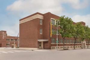 a brick building on the corner of a street at The Slate Hotel Denver Downtown, Tapestry by Hilton in Denver