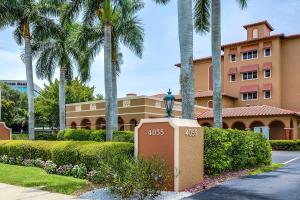 a building with palm trees in front of a street at Inn of Naples, Tapestry Collection by Hilton in Naples