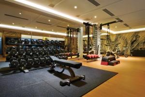 a gym with dumbbells and weights in a room at Doubletree By Hilton Shah Alam I-City in Shah Alam