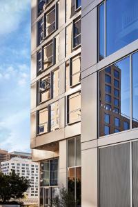 a facade of a building with large windows at Conrad Los Angeles in Los Angeles